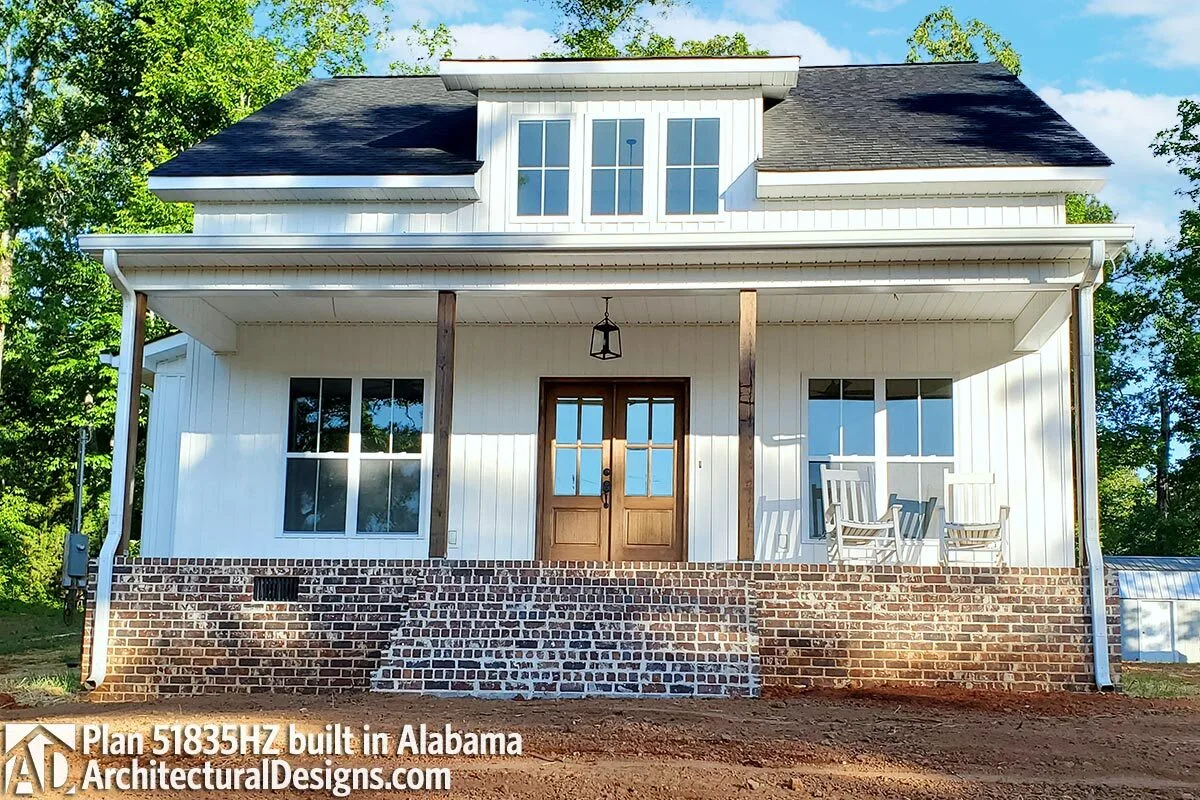The glass windows complement the traditional aspect of a cottage house.
