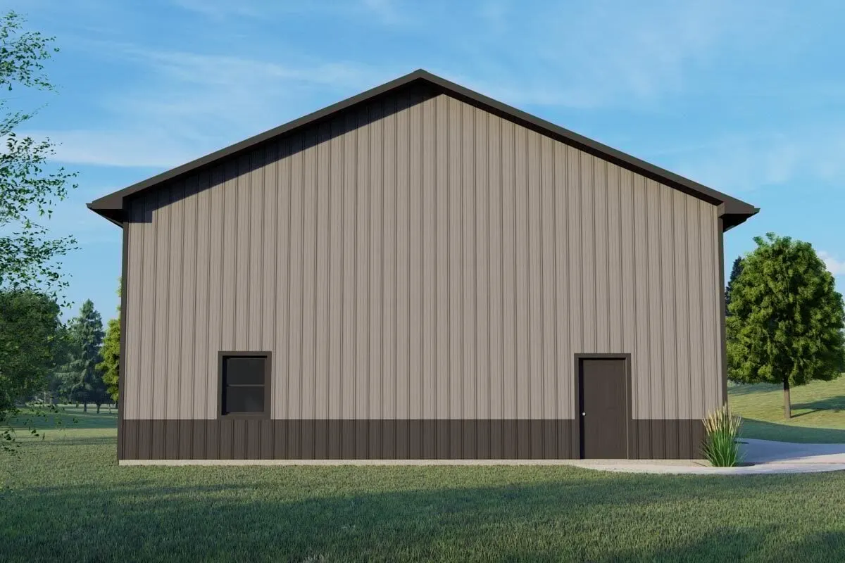 Door access to the garage and a window are provided by the side door of the barndominium.