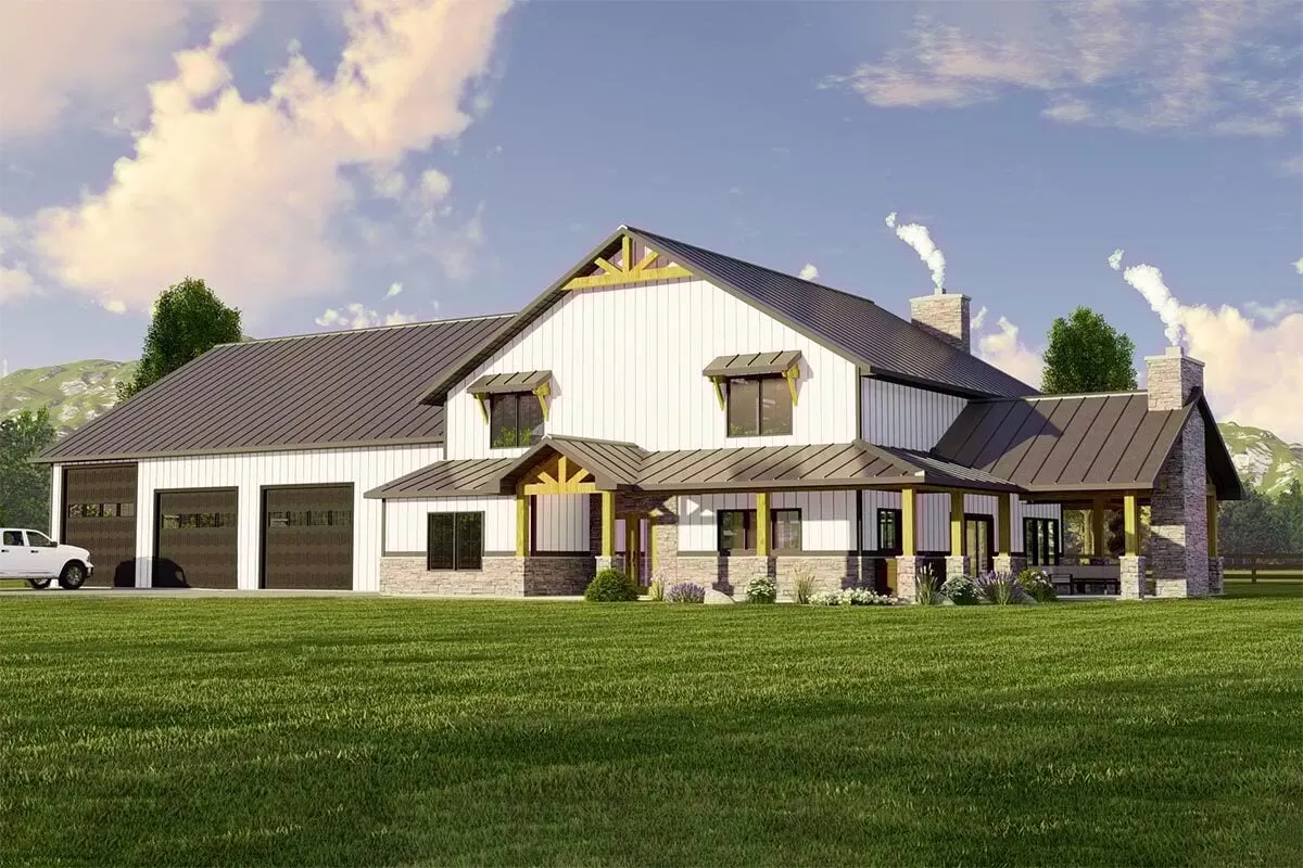 This is a view of the modern barndominium farmhouse in white color, which features a huge garage and a lot of open ground.