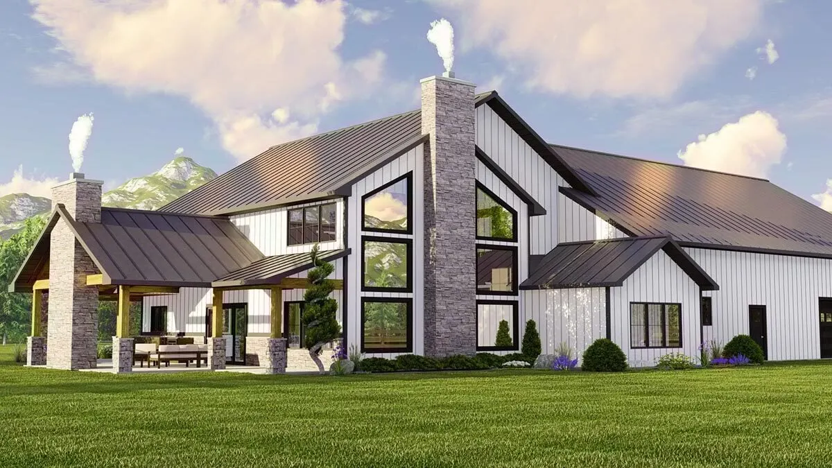 Beautiful glass windows and chimneys can be seen on the front side of this barndominium modern farmhouse.