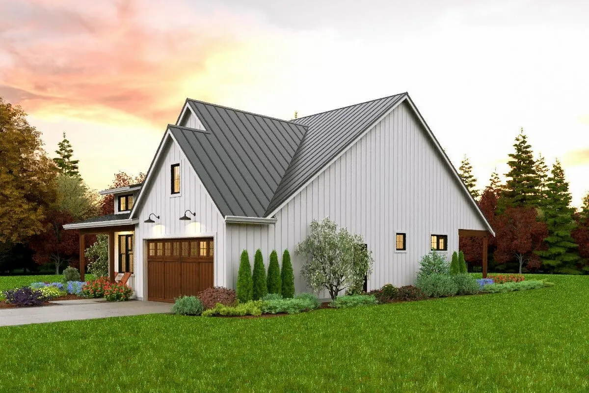 Right view of the home with surrounding landscape and a white wall paint exterior.