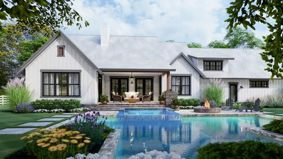 The farmhouse in the background has a complete view of the pool.