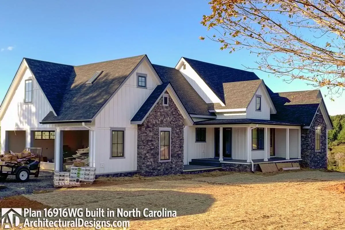 View of the home from the side, highlighting the three-door garage space.