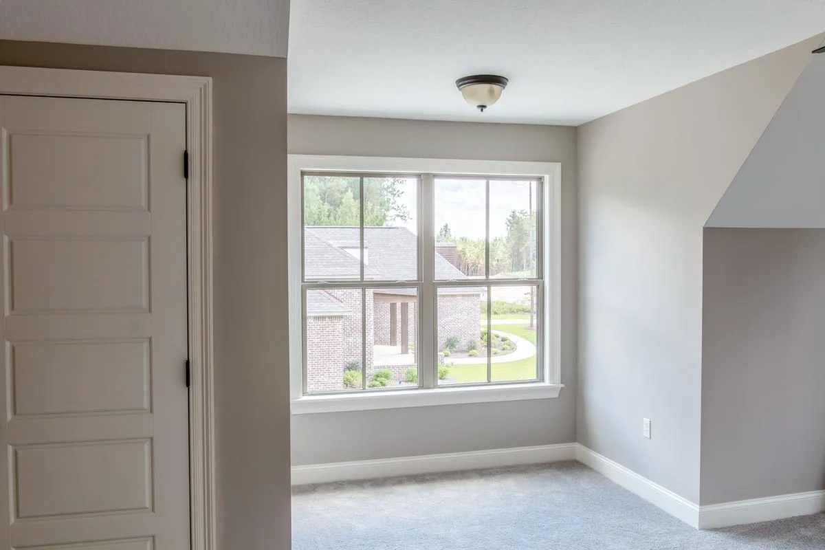 A second-story window with a view of the outside.