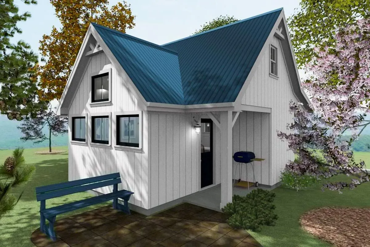 The back of the house, with a small patio to sit on.