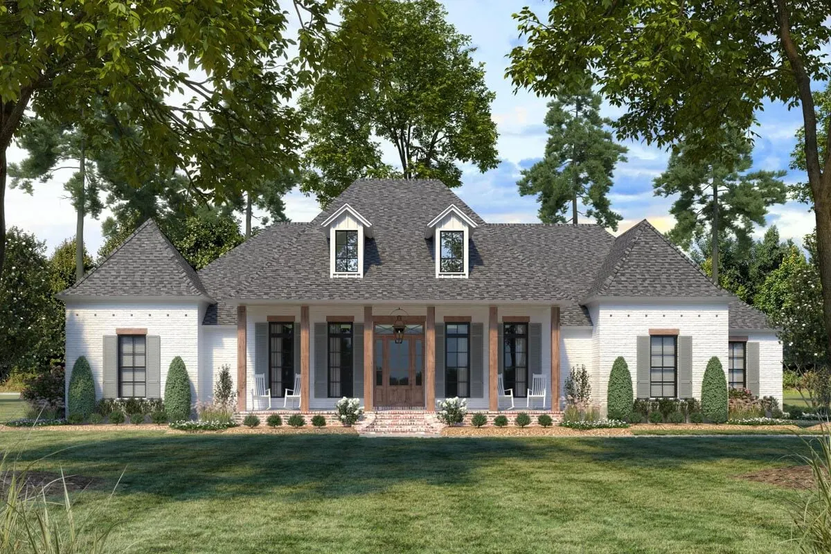 The home's front aspect shows a welcoming porch area with red brick flooring, steps, and wooden pillars.