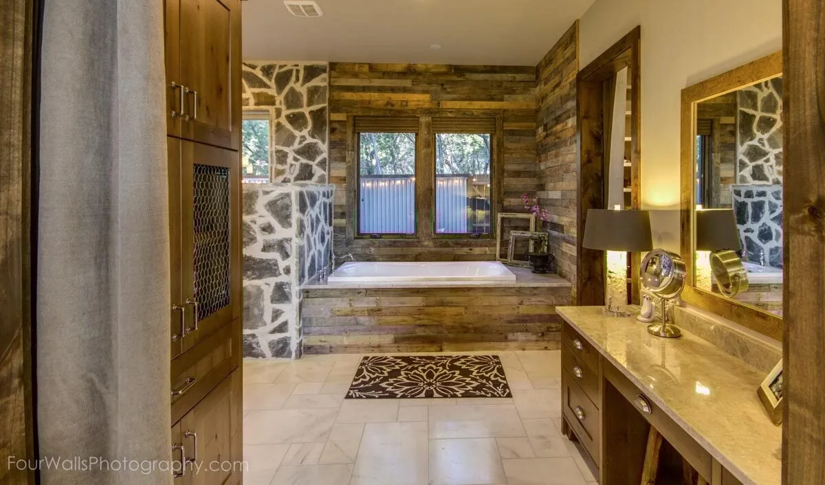 Take a peek inside the luxurious bathroom and see the marble tabletop basins and soaker tub.