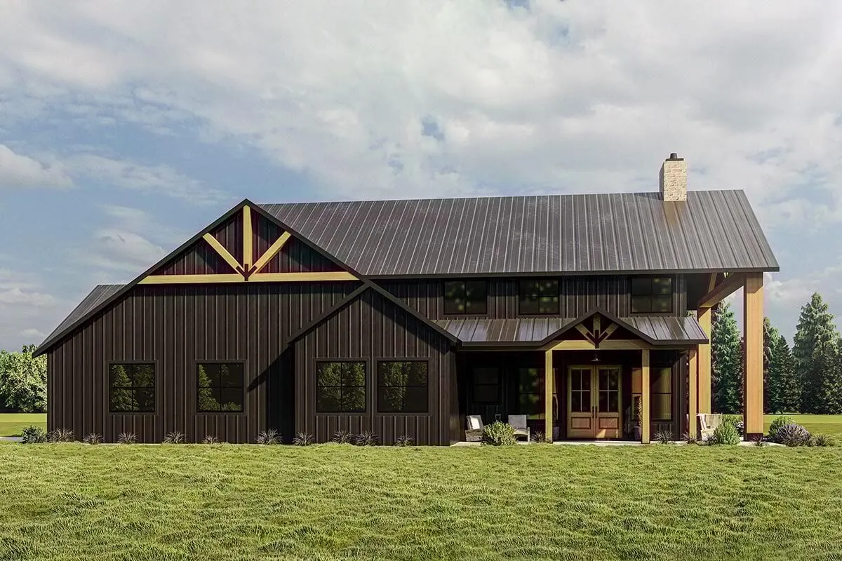 The large entryway and triangular frames of the home are highlighted in this view from the side.