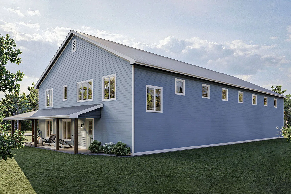 The view from the side of the house highlights the small glass windows on the second floor.