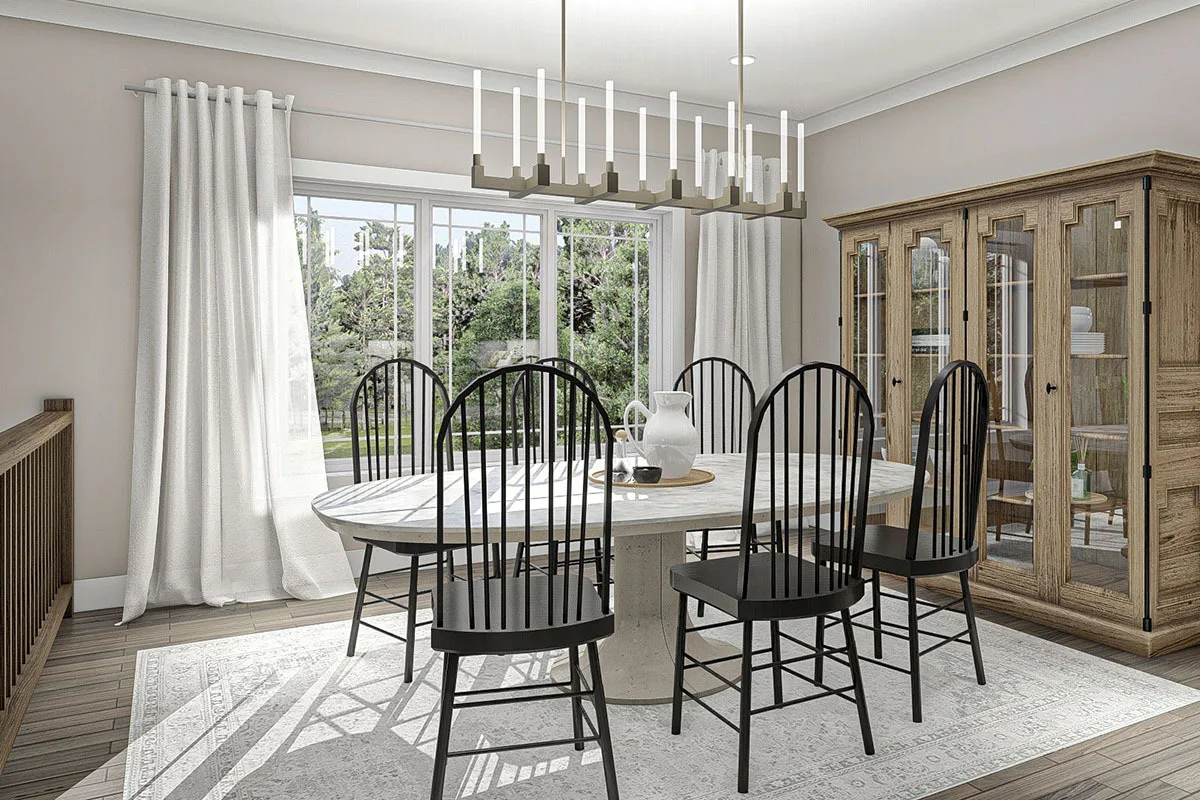 A look at the dining area with an aesthetic chandelier, built-in cabinet, and a huge glass window. 