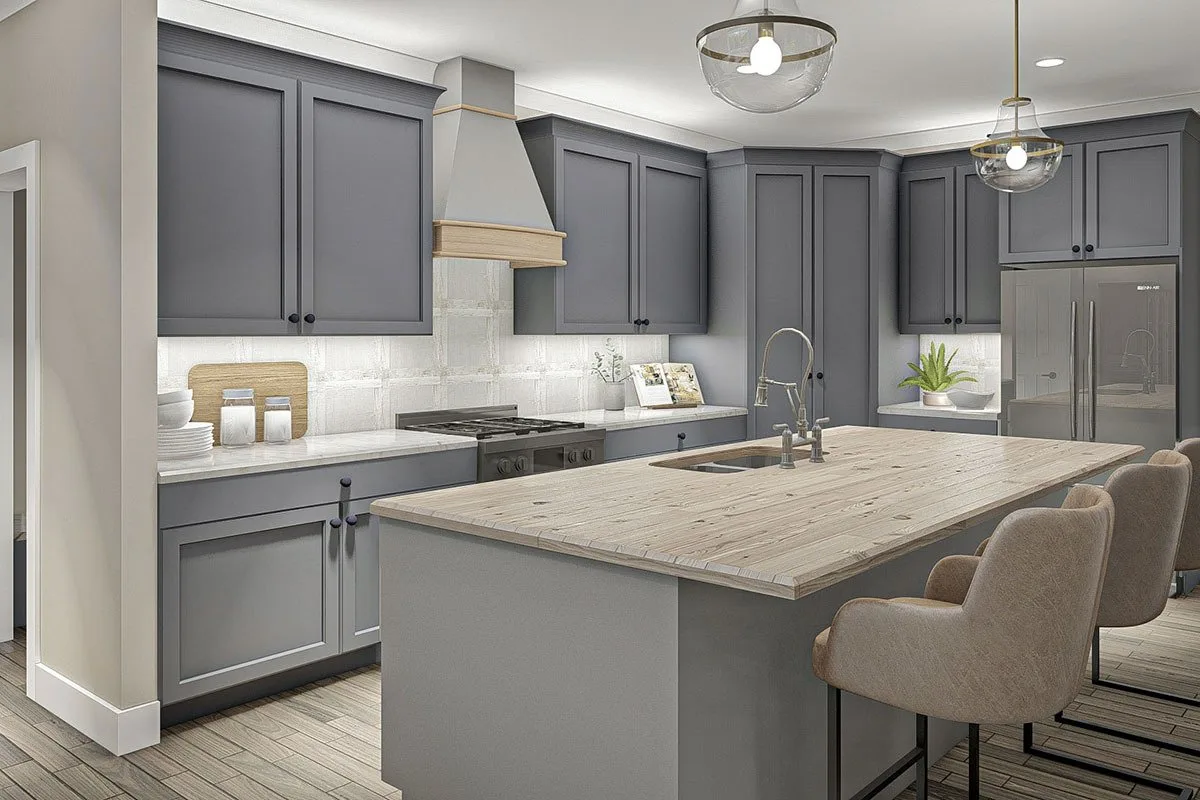 The kitchen space with built-in cabinet and a kitchen island in color gray that is aesthetically pleasing to the eyes.