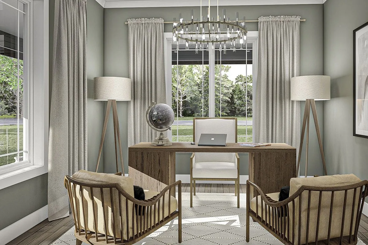 A view of the home office, which has walls painted in a gray color that goes well with the ornate chandelier.