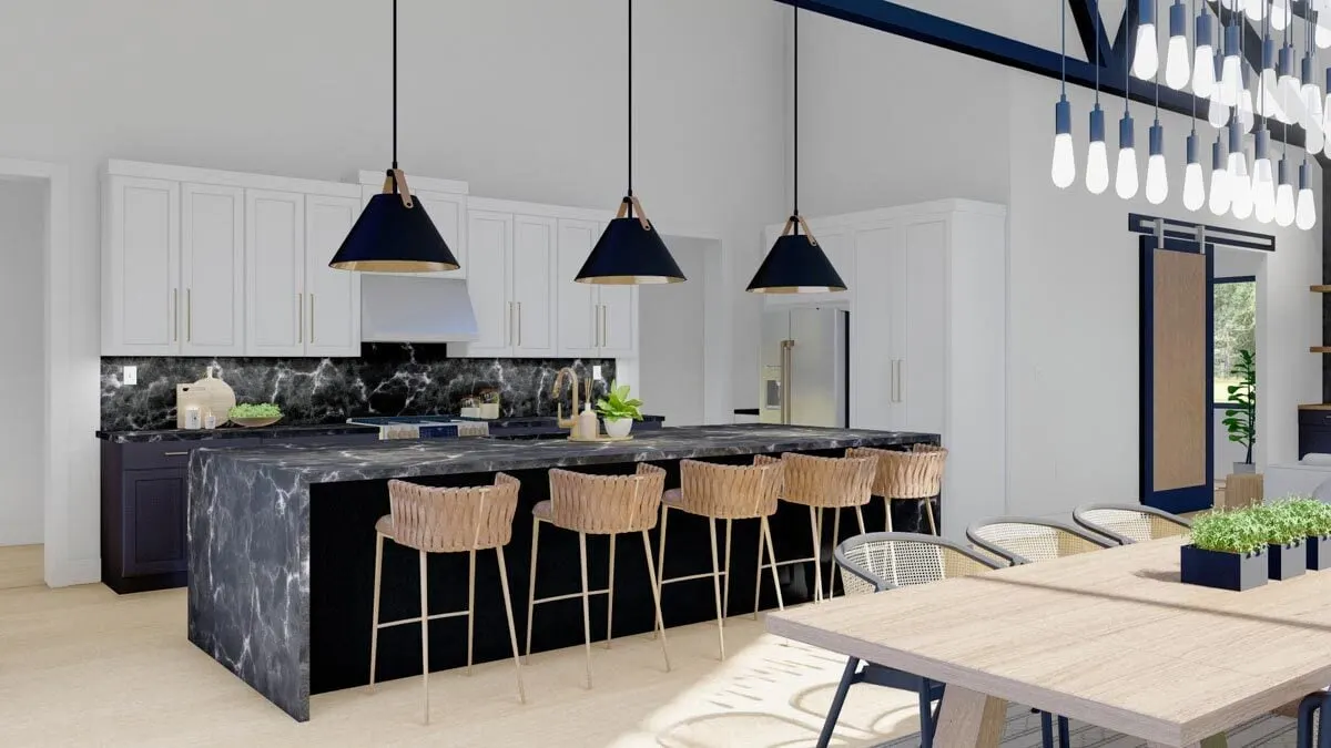 A better look at the marble countertops, beautifully crafted lighting, and custom-built cabinetry that make up the kitchen island.