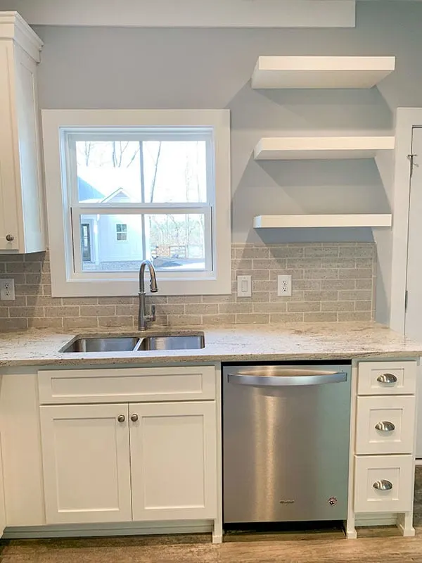 A kitchen sink with easy storage appears to be efficient.