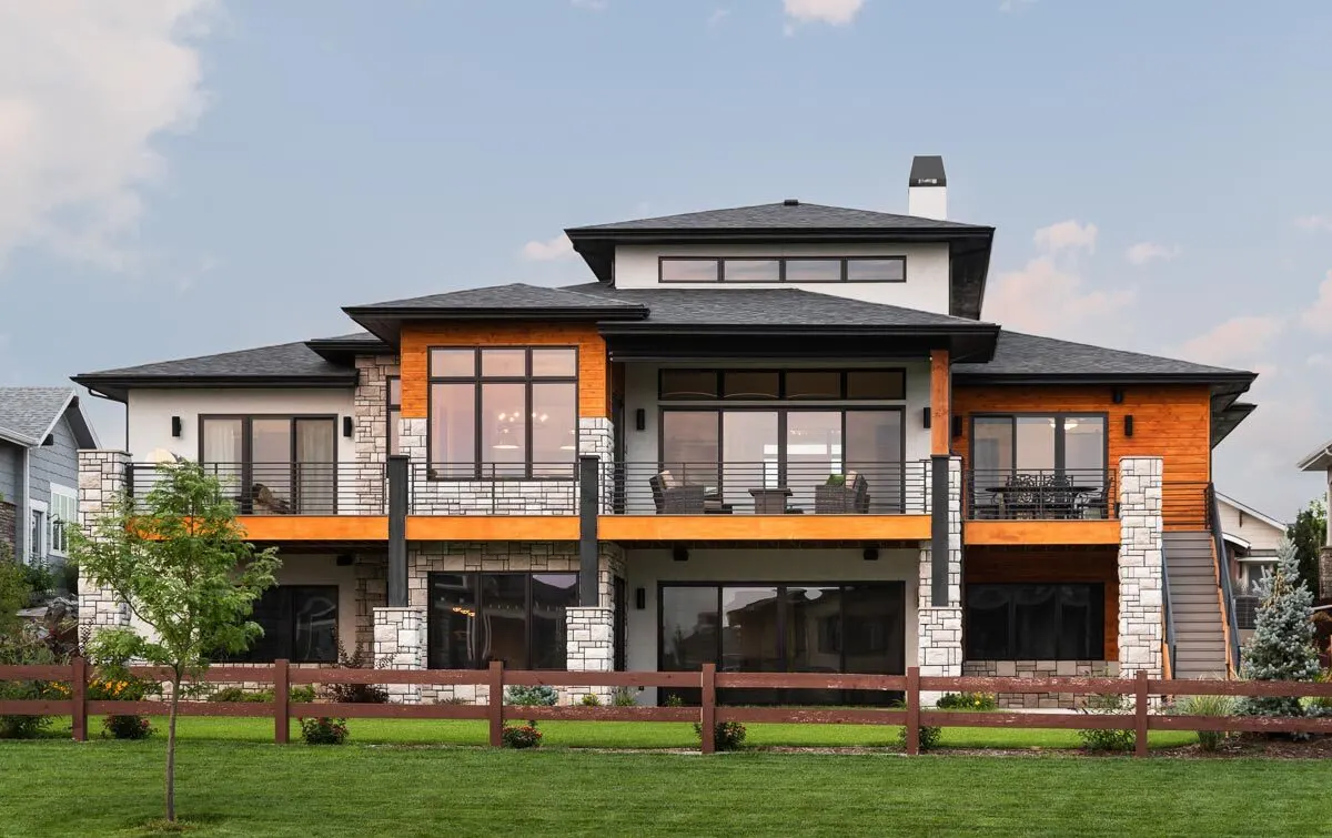 White stone tile is used as a support frame towards the back of the home.