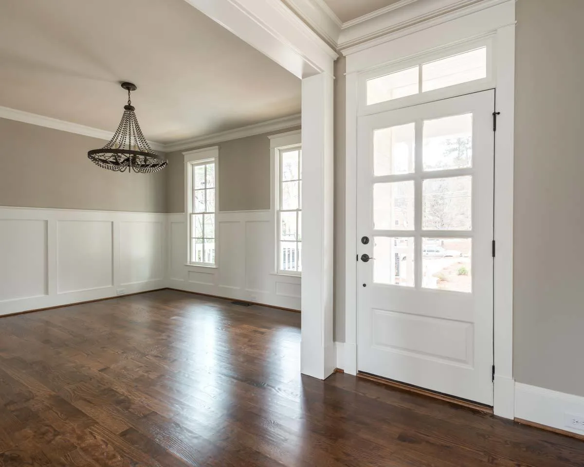 The main entrance's white inside paint complements the room's gray walls.