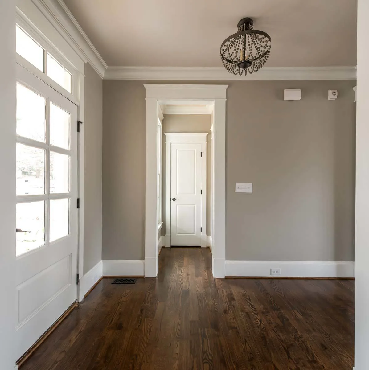 A narrow entrance leads to the powder room area.