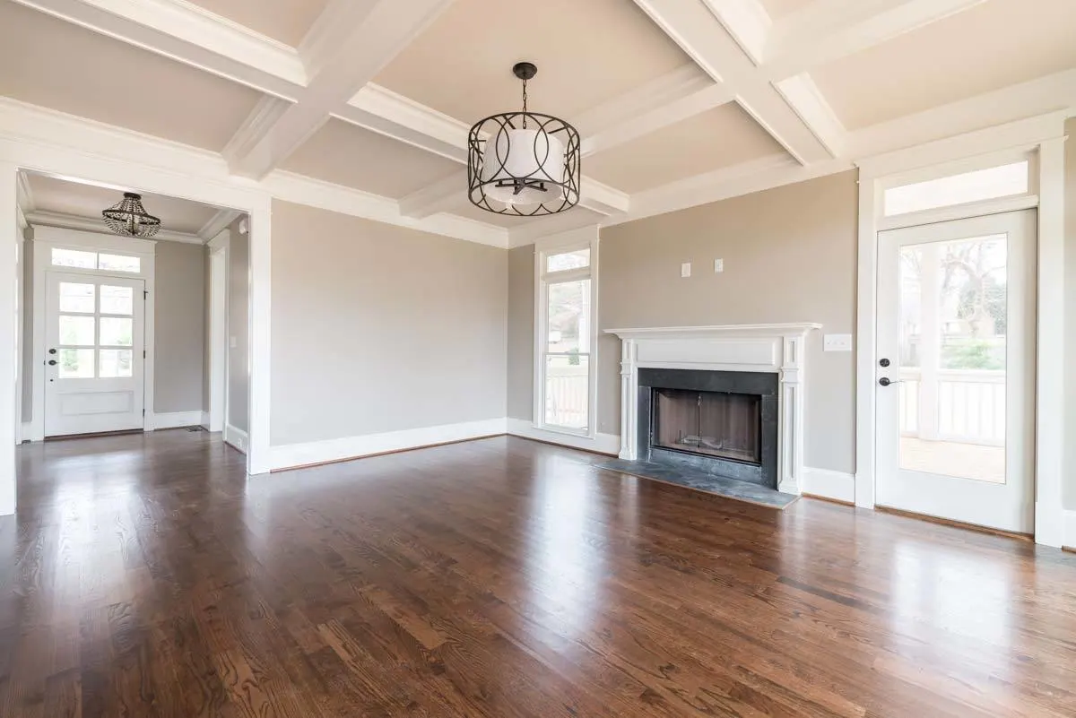 A large space with a beautiful ceiling design for the living room.