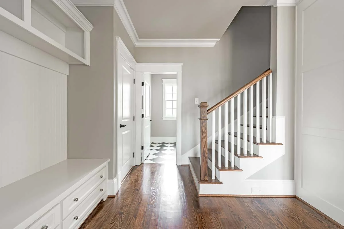 Stairs to the second floor with a wooden accent style.