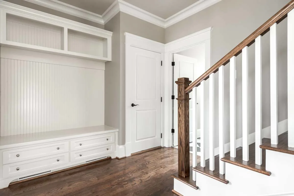 A mudroom where items can be dropped and stored.
