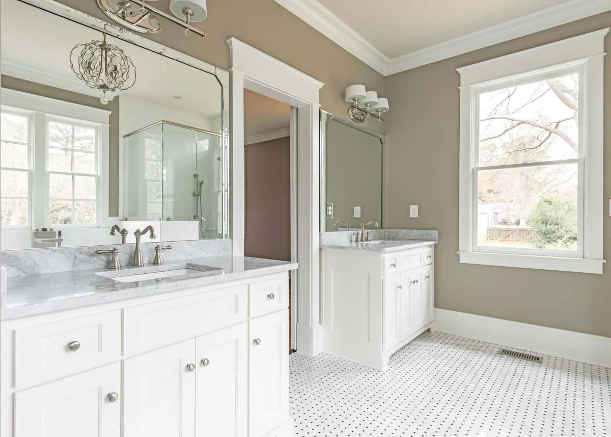 Elegant vanities with mirrors and lighting accessories.