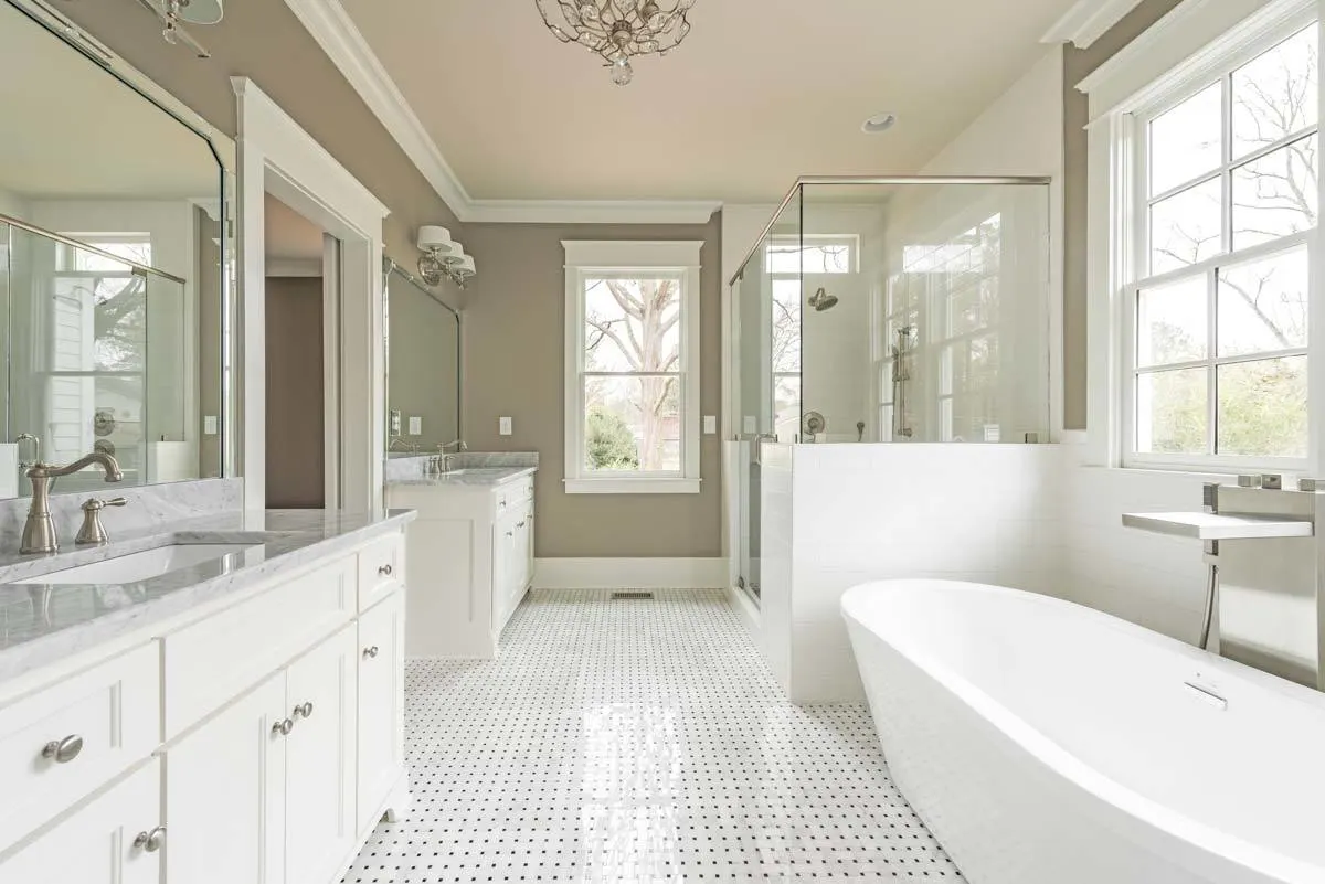 Beige paint on the walls and black dots on the flooring in a flawless design.