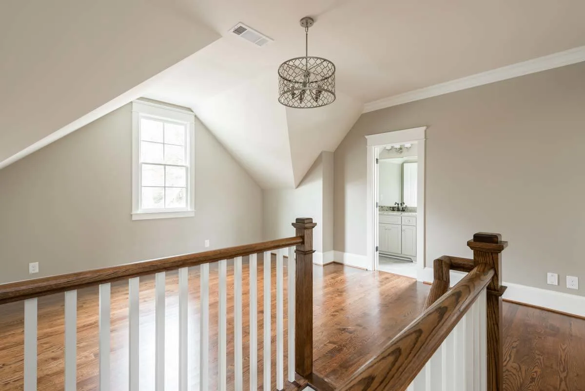 A high ceiling features in the second level area.