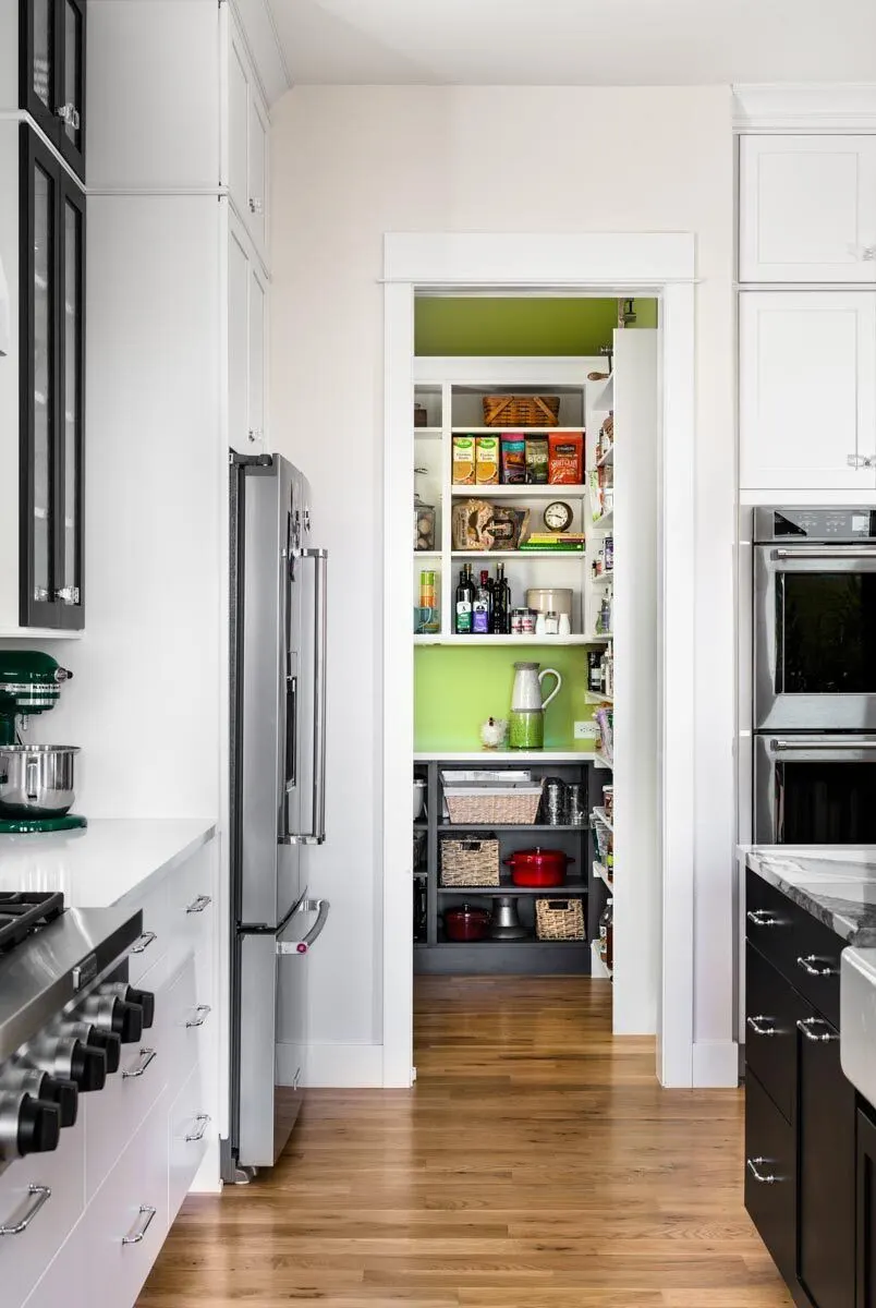For additional storage, the kitchen boasts a large pantry.