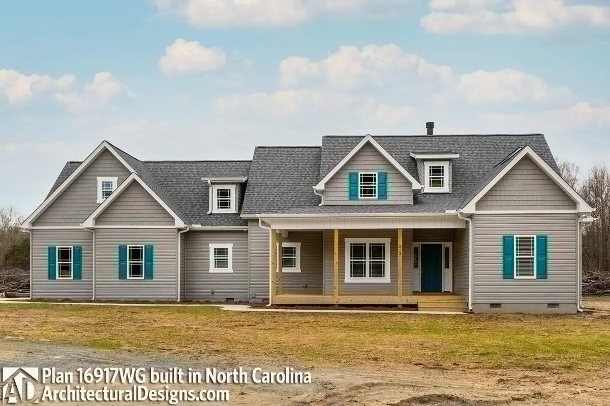 This new American modern farmhouse with a bonus room is seen, with the elevated main entry porch.