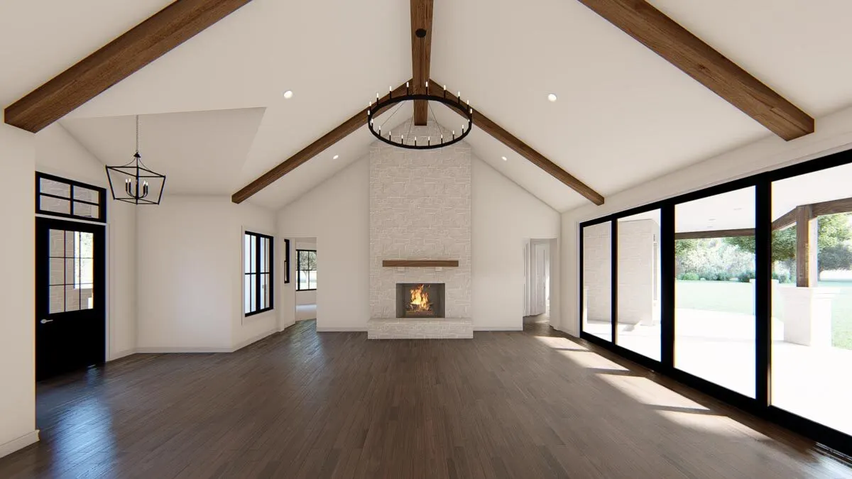 The living area with fireplace looks amazing against the brick wall and has stunning large windows.