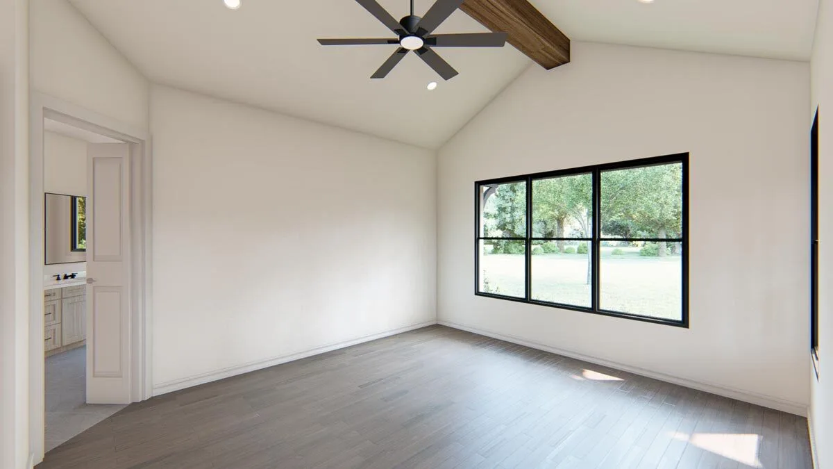 The master bedroom features a huge window with an outside outlook and a cathedral ceiling.