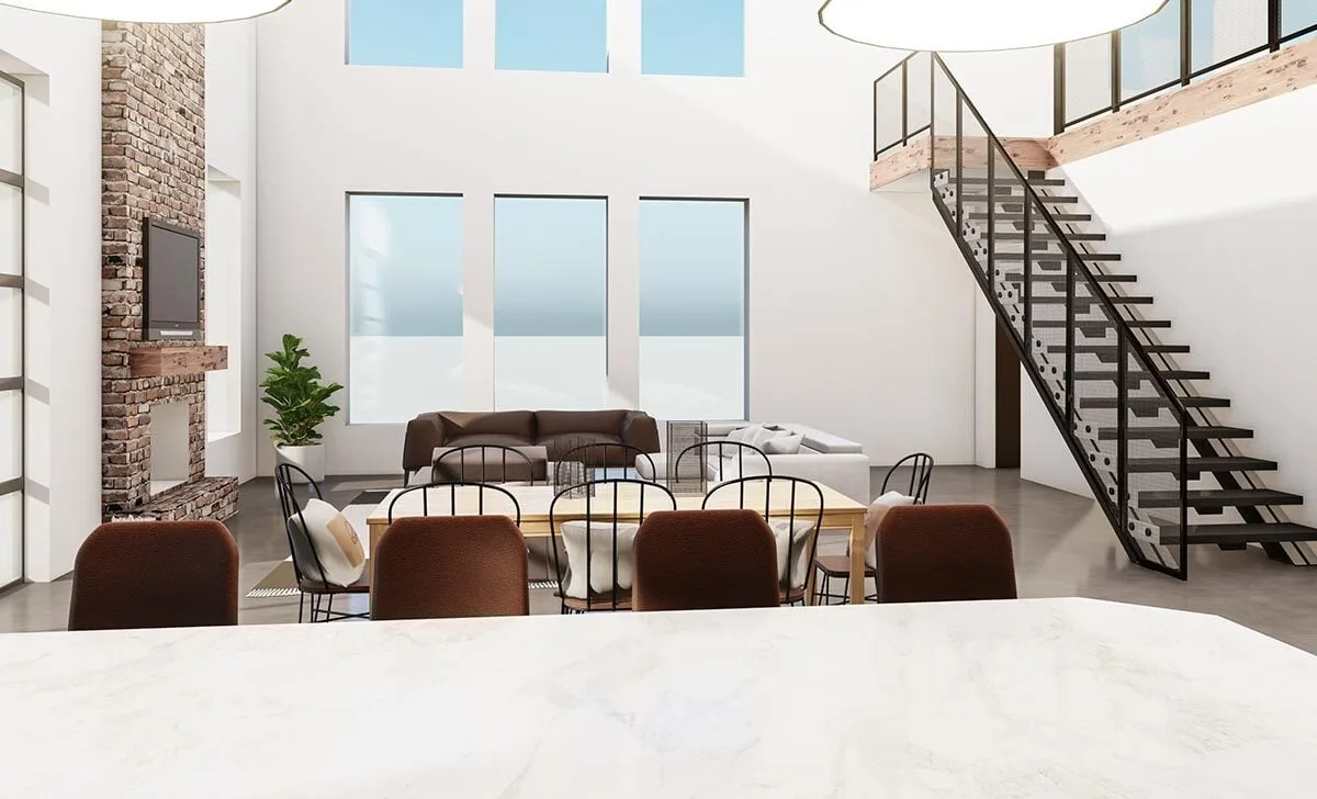 A wide look at the entertainment room shows a three-glass window placed perfectly, and a staircase.