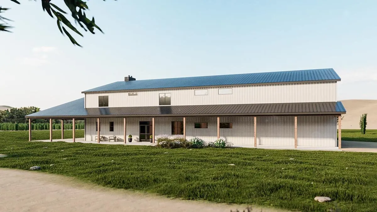 A wide view of the side of the barndominium highlights the covered patio.