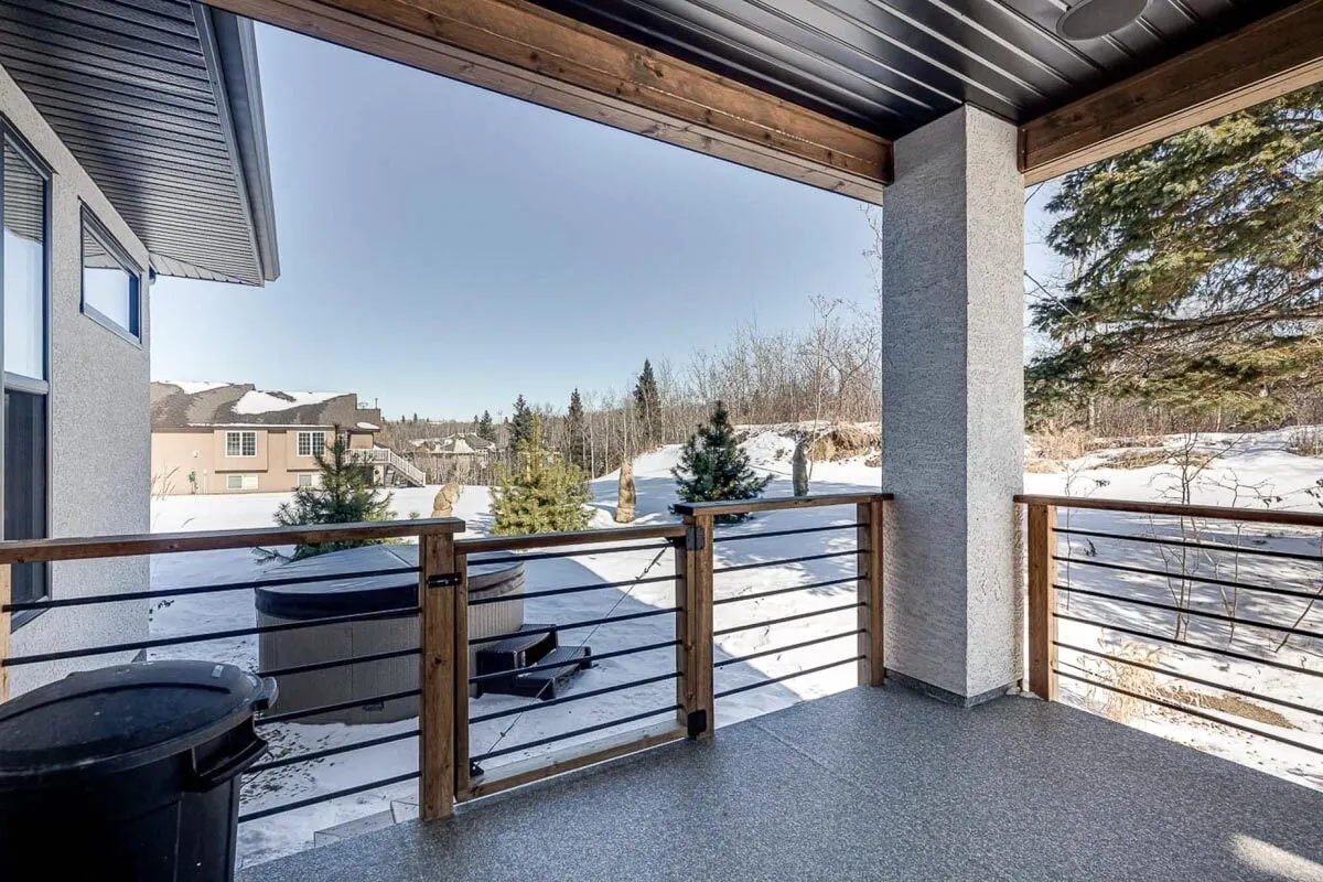 Back-covered deck with a visible fire pit outside the area.