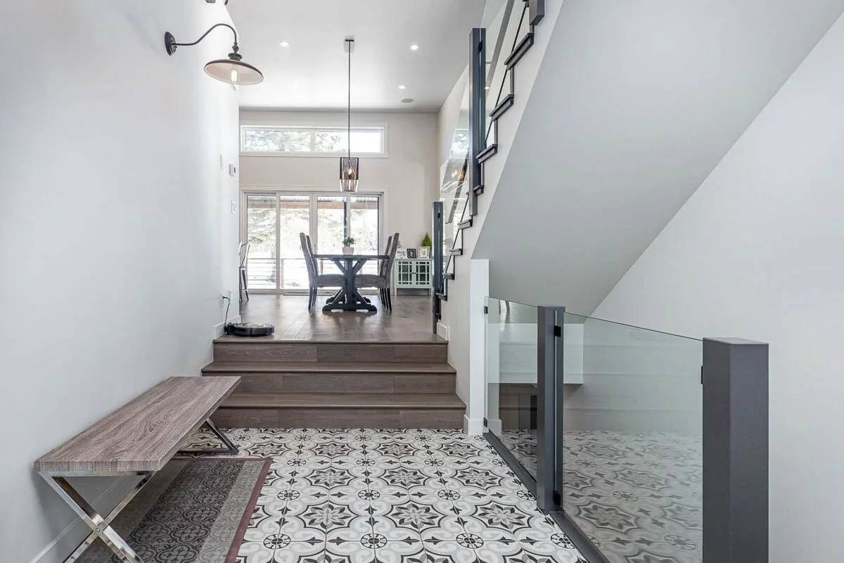 Straight ahead of the dining area from the front door.