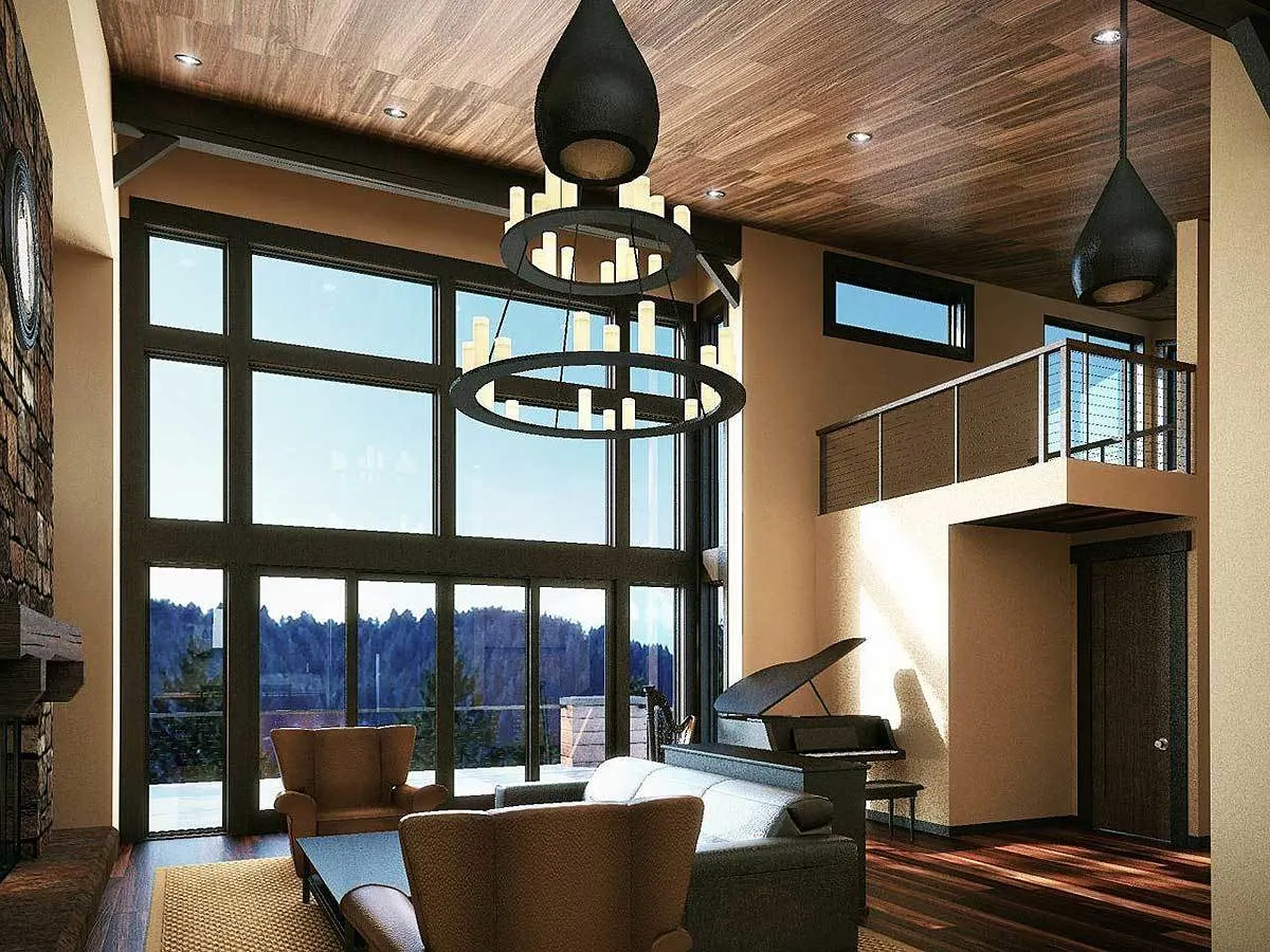 The great room has a serene appearance, with a high ceiling and a magnificent chandelier.