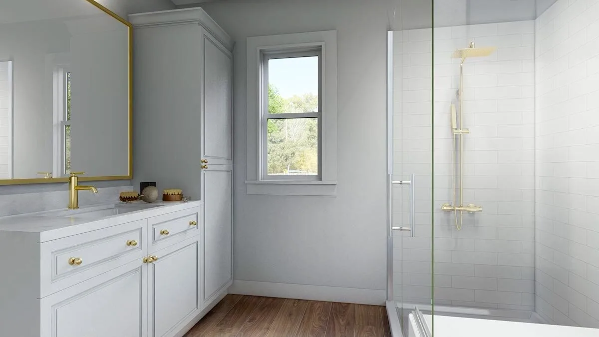 The sink of the bathroom is white in color with a touch of gold on the knobs, faucet, and mirror 