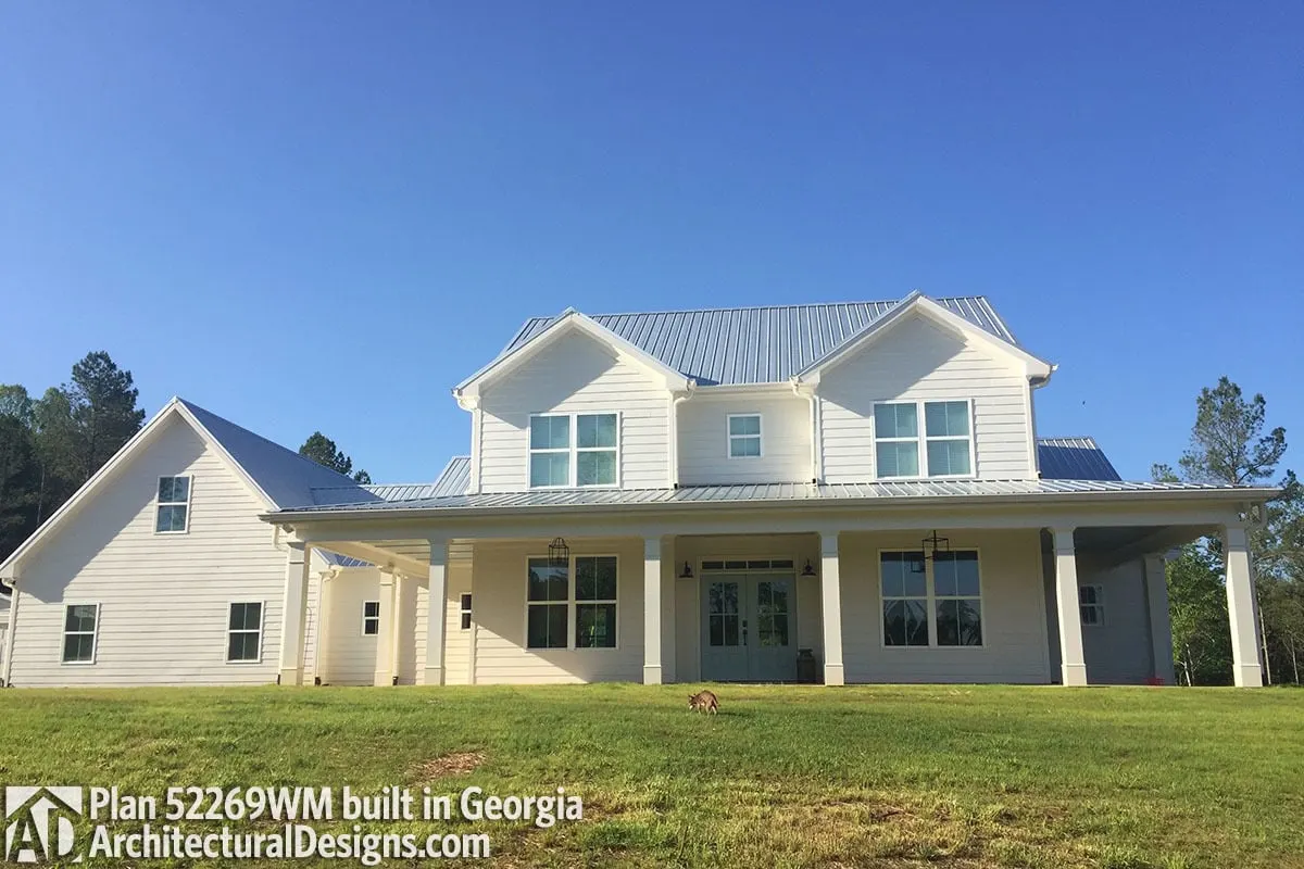 Another rendition of a country farmhouse with a wonderful wraparound porch and French doors and windows.