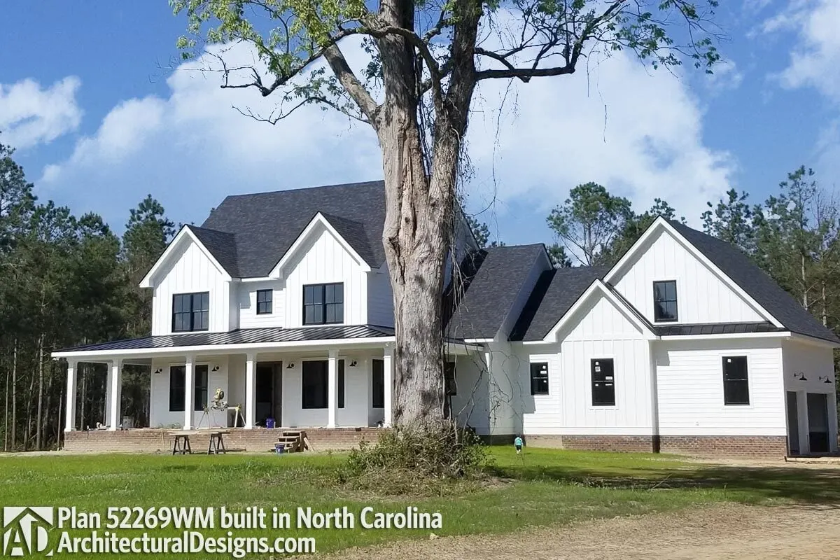 From a distance, the farmhouse appears exquisite with a spacious garage area.