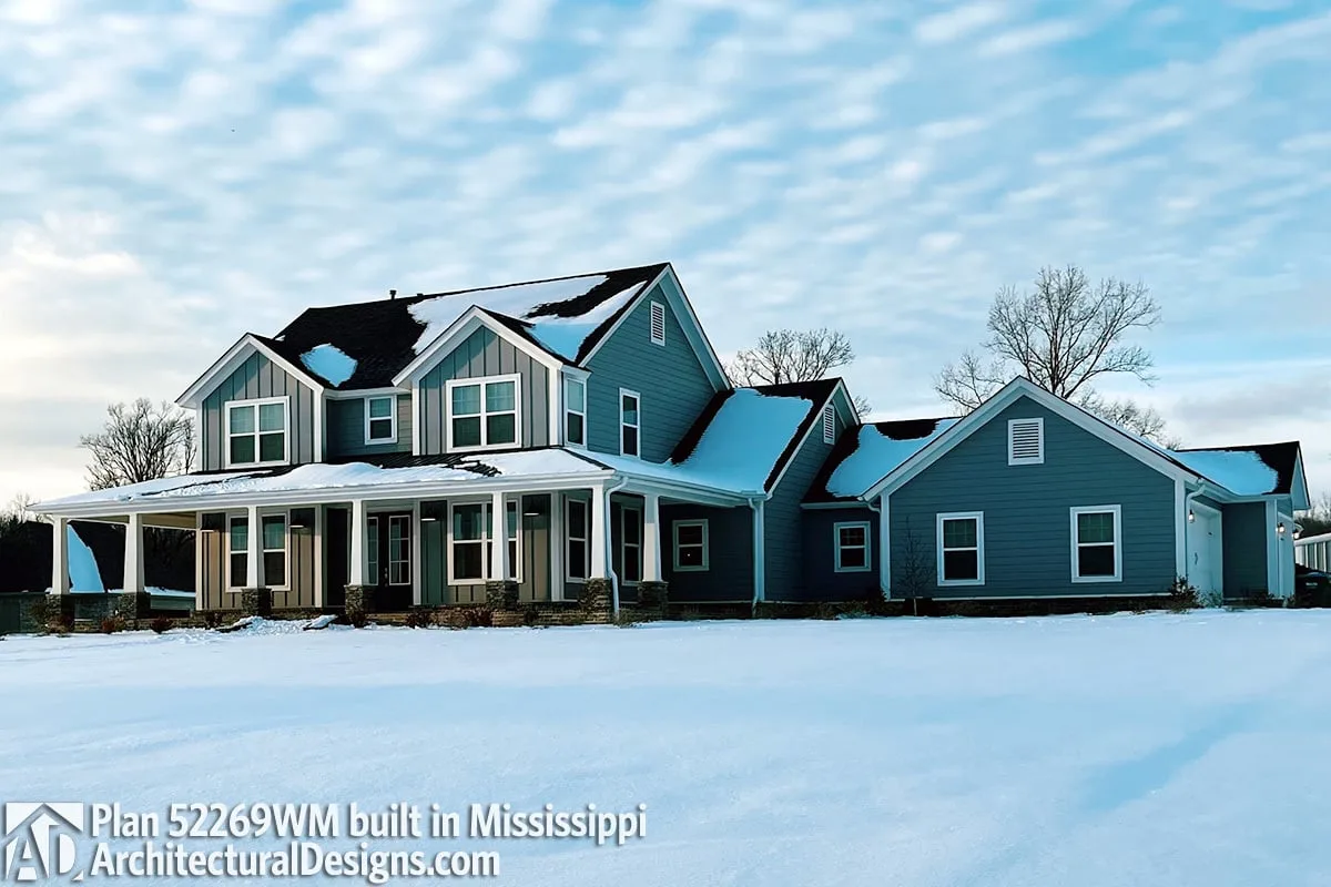 An attractive image of a farmhouse in the winter.