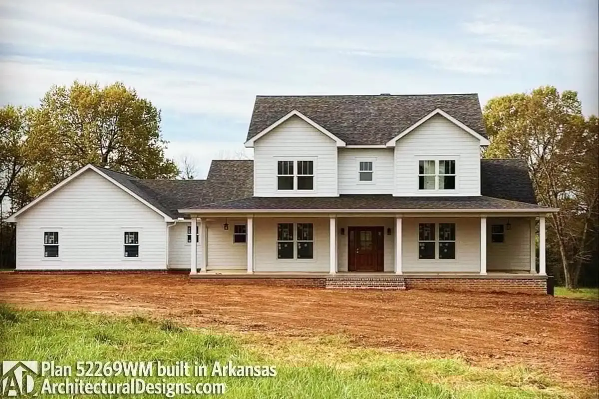 A freshly constructed farmhouse in excellent view displays amazing style.