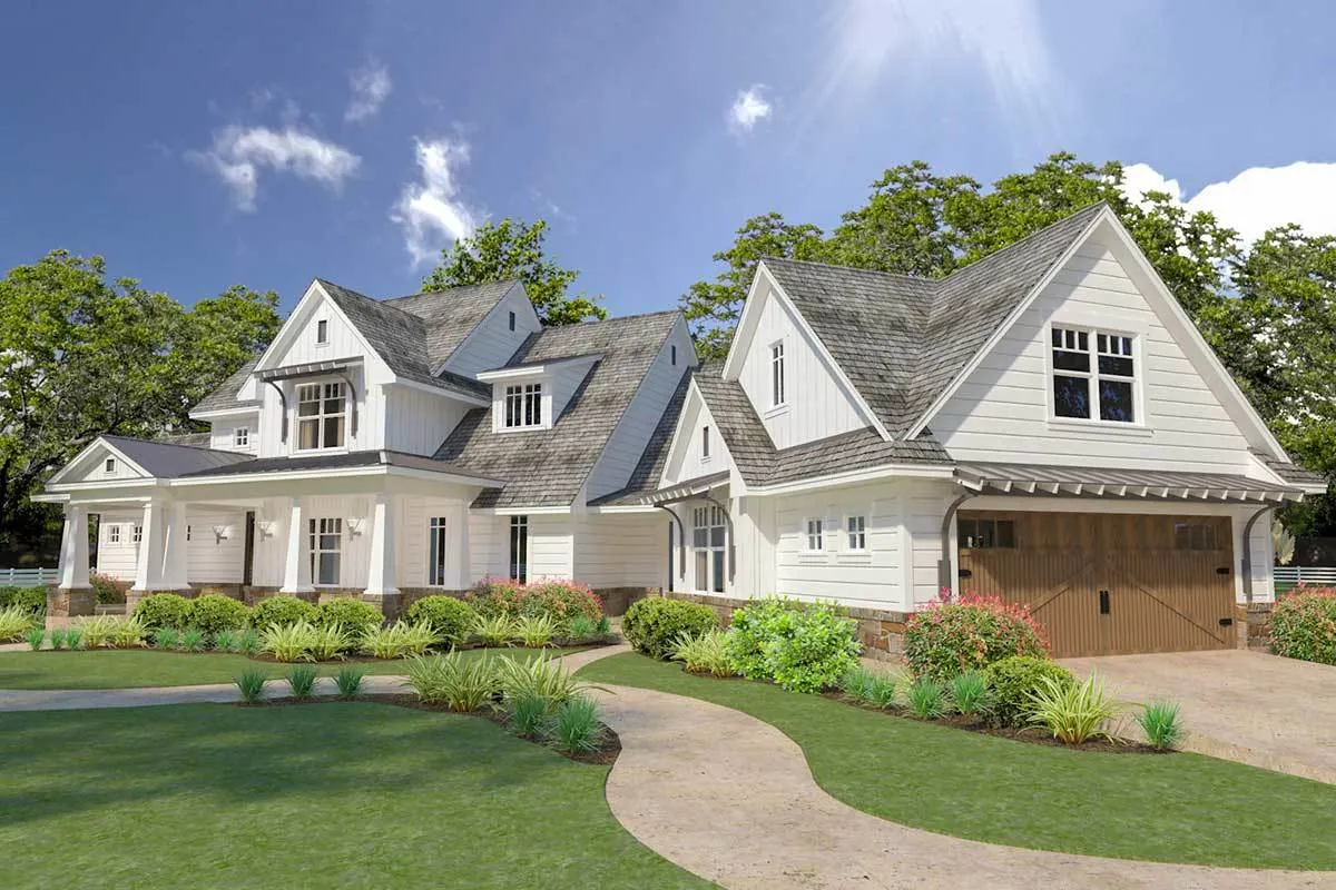 The large garage space is seen in this side view of the farmhouse.