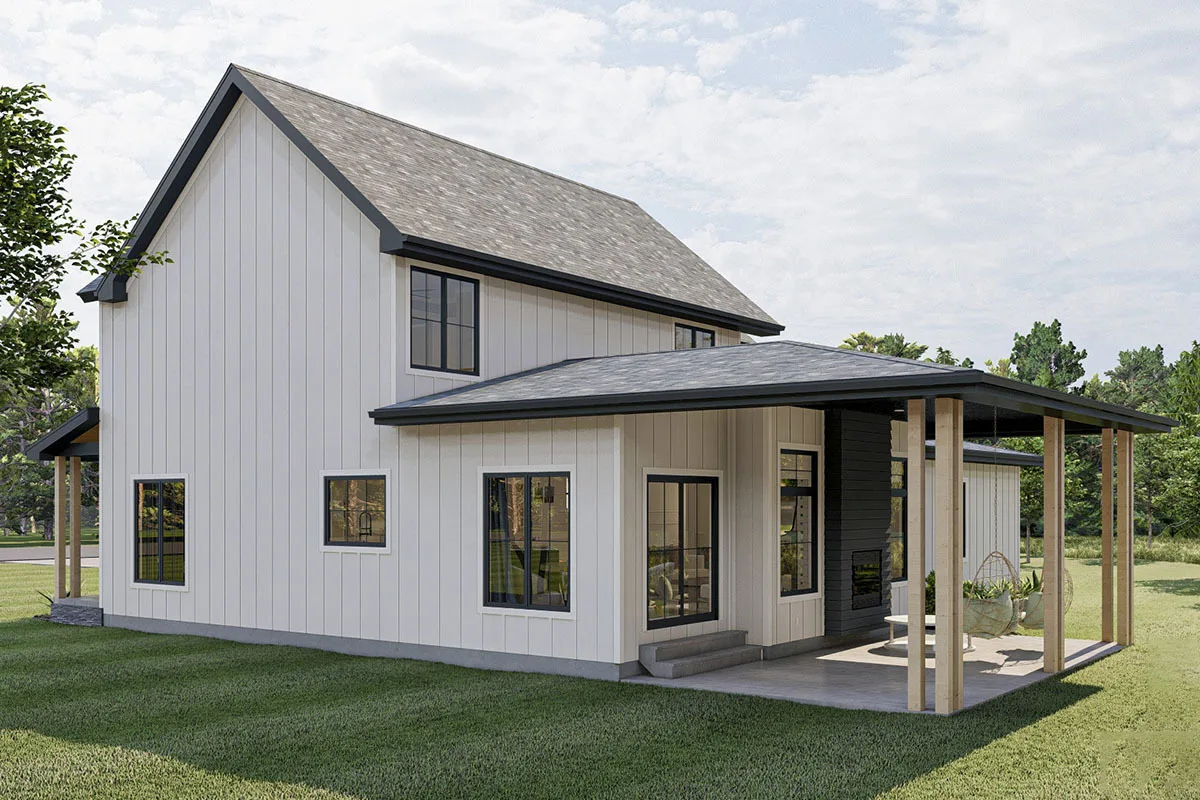 Two porch swings are on a back-covered patio with wooden pillars.