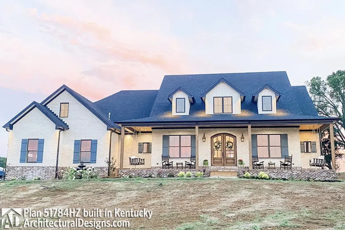 The front porch of a built-in farmhouse in Kentucky looks lovely.