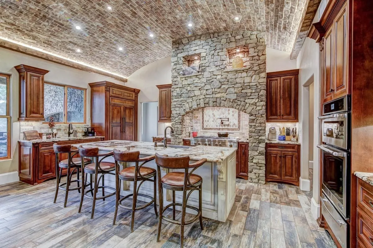 Kitchen with a rustic interior design and gorgeous stone architecture.