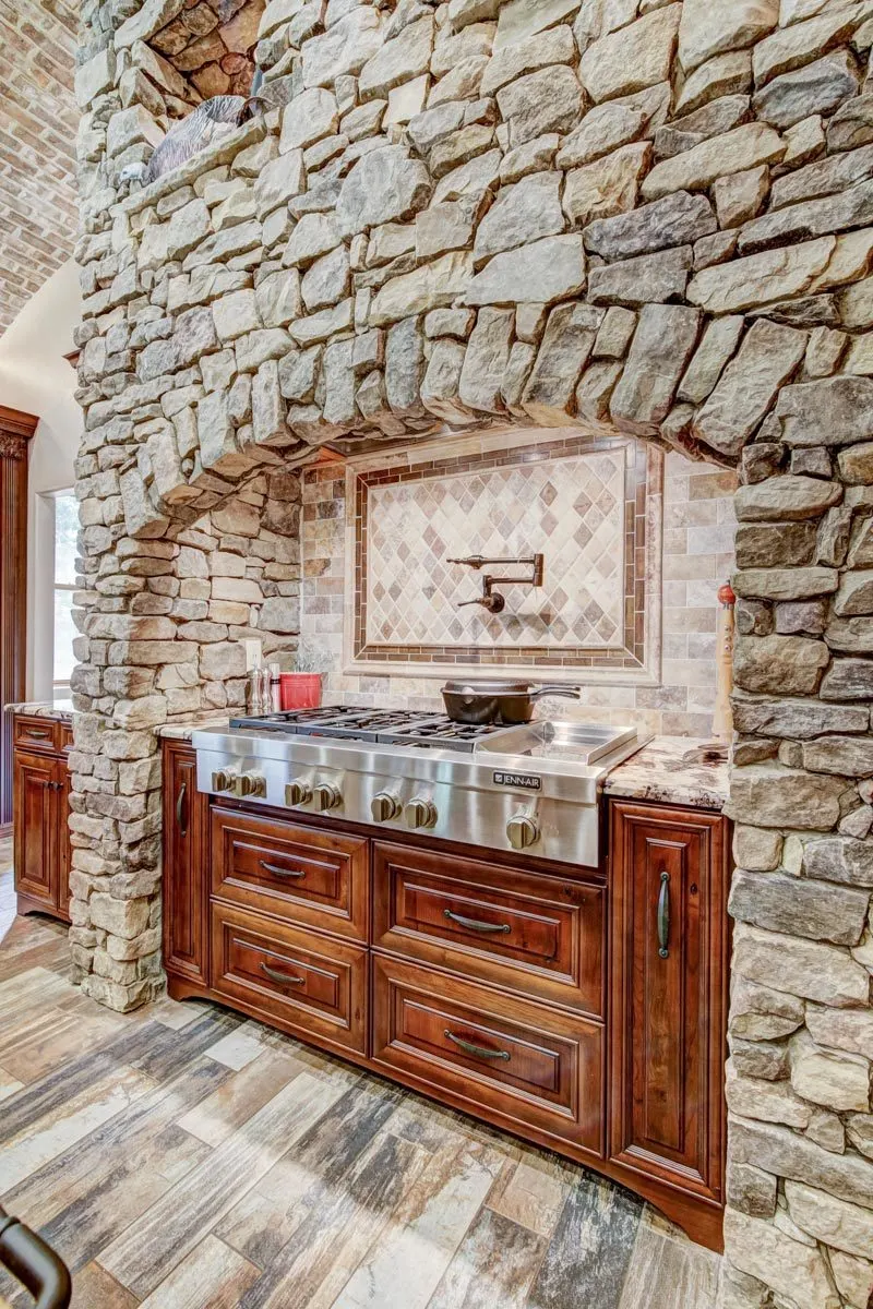 A nostalgic kitchen facade in stone, brick, and tile design frame.