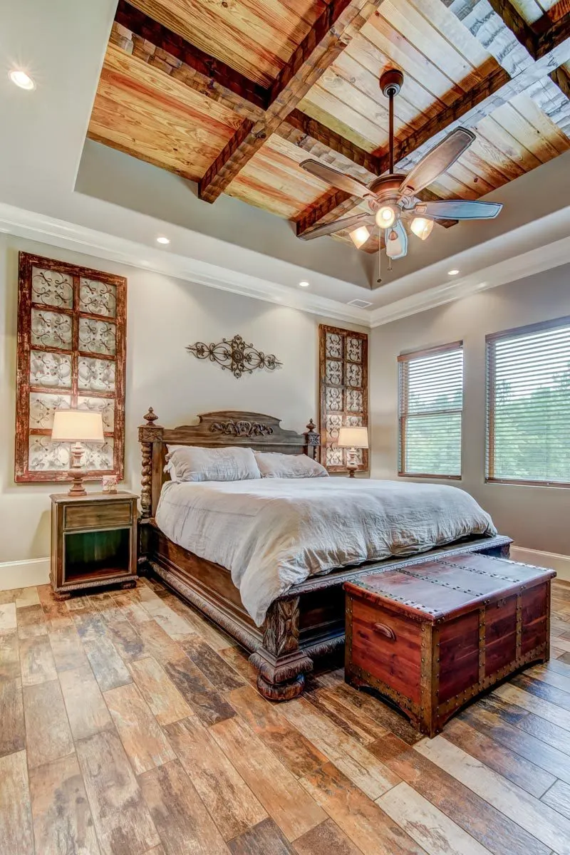 A big antique design bedroom with distinctive rustic style furnishings.