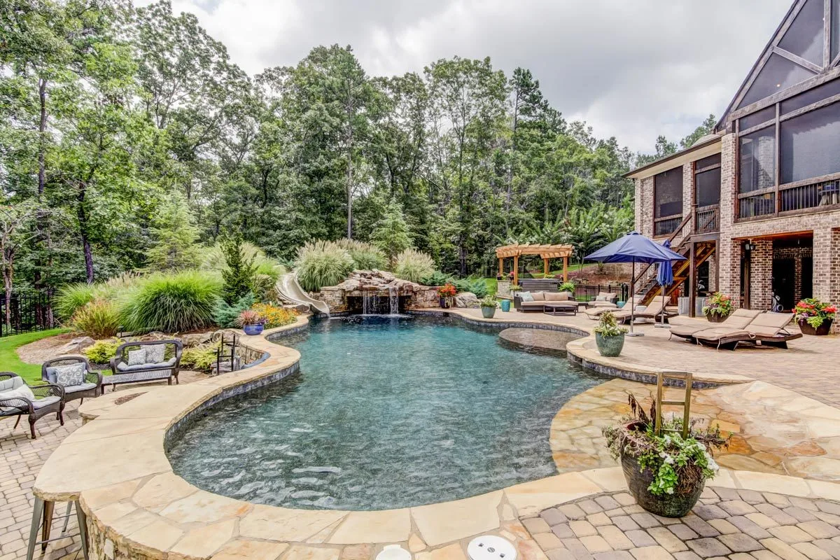 The back pool area in stone design landscape merges well with the garden scenery.