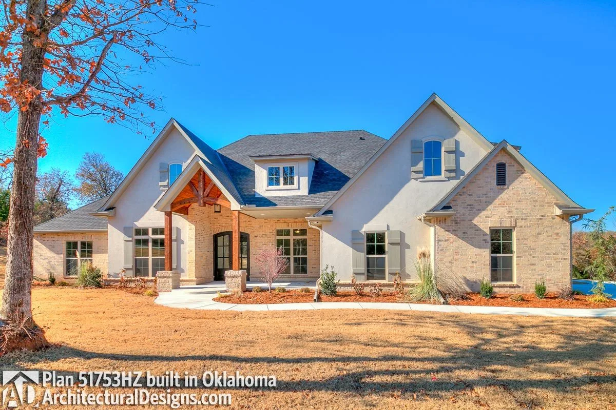 The use of barn-style shutters and a brick-style wall truly make the façade stand out.