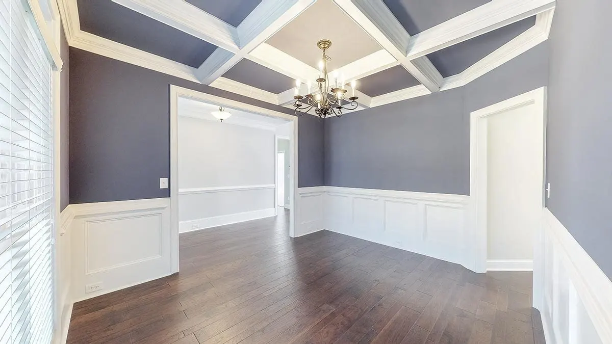 The wooden flooring is complemented by the lovely white and gray paint used in the space.